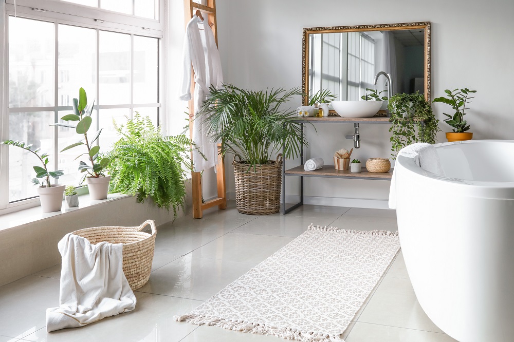 In bathrooms, carefully placed plants can liven up the dull, hard surfaces.