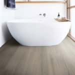 Vinyl flooring is better for bathrooms and other areas prone to spills