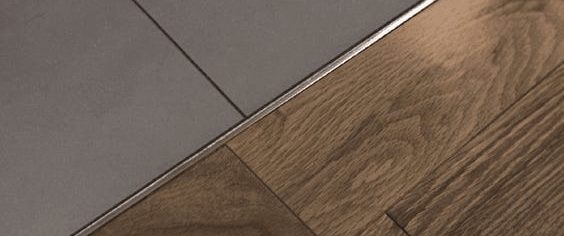 An example of a raft of timber flooring transitioning to tiles.
