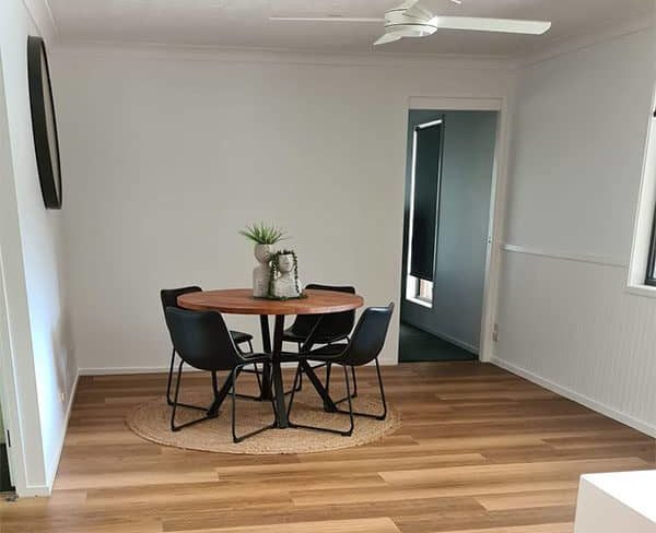 Dining area with blackbutt flooring.