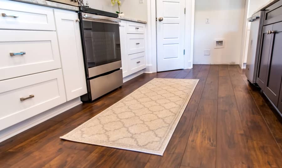Modern kitchen with hardwood flooring.