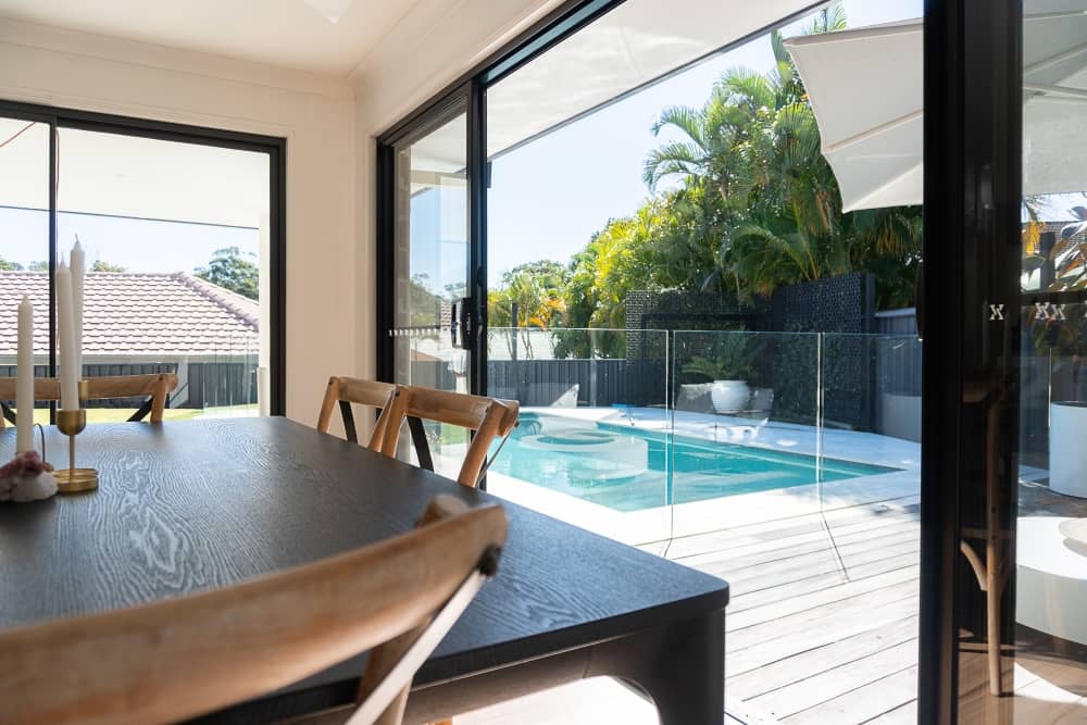 View of outdoor pool area from the kitchen.