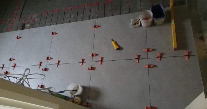 Tile flooring installation over underfloor heating.