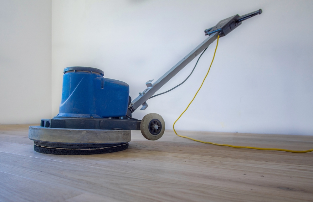 Buff the floor with a buffer or polisher using a fine-grit screen or pad.