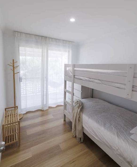 Bright bunk room finished with Eclipse Hybrid with Nazca flooring in short stay retreat