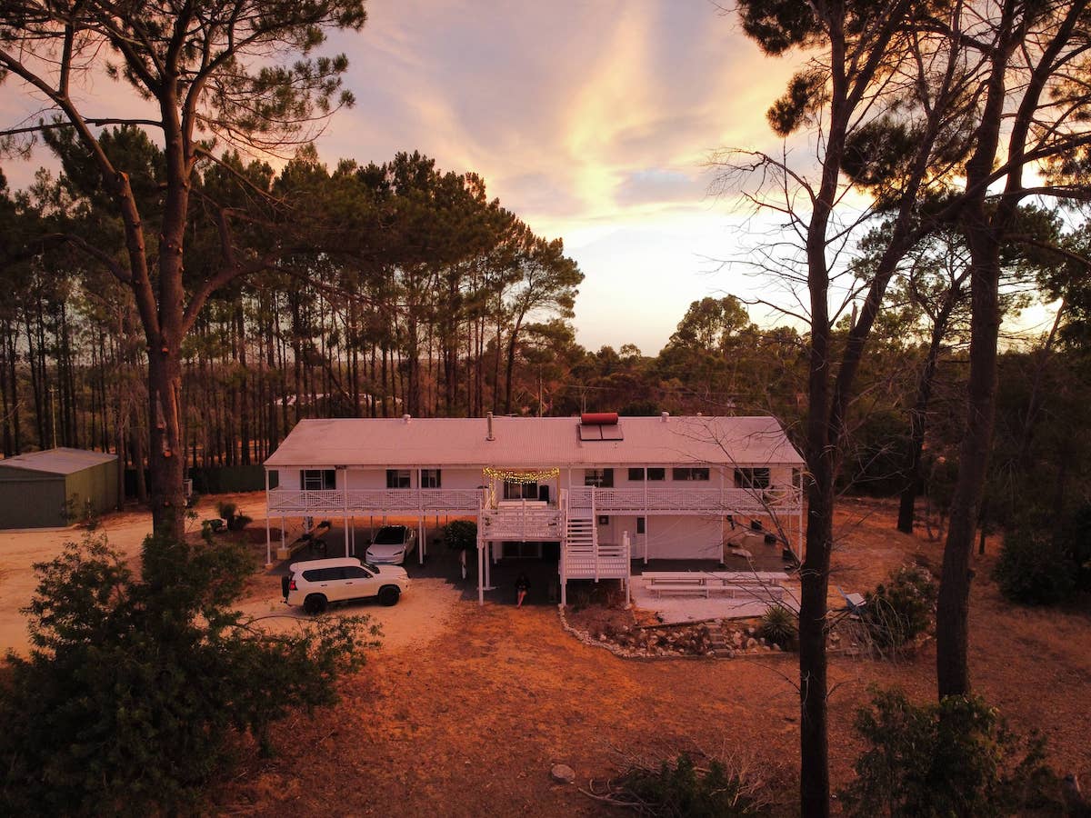 Exterior view of bush retreat at Moore River accommodation with wraparound deck and Eclipse Hybrid with Nazca flooring inside