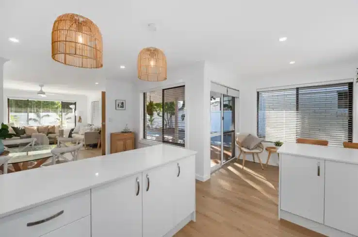 Modern Australian duplex renovation with hybrid flooring, open kitchen and dining area