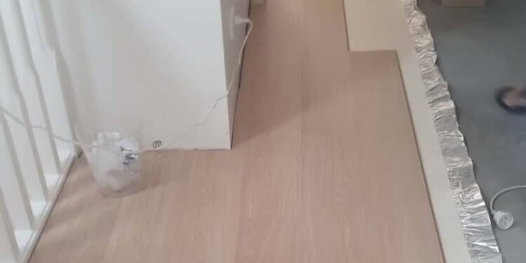 Laminate flooring laid through hallway during renovation