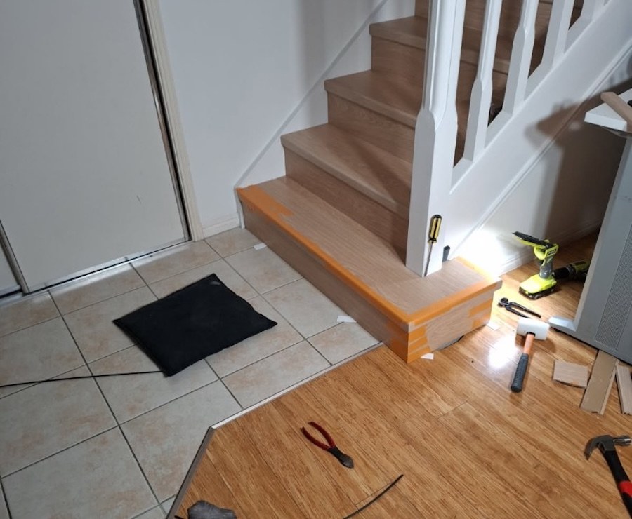 Laminate staircase renovation during home flooring upgrade
